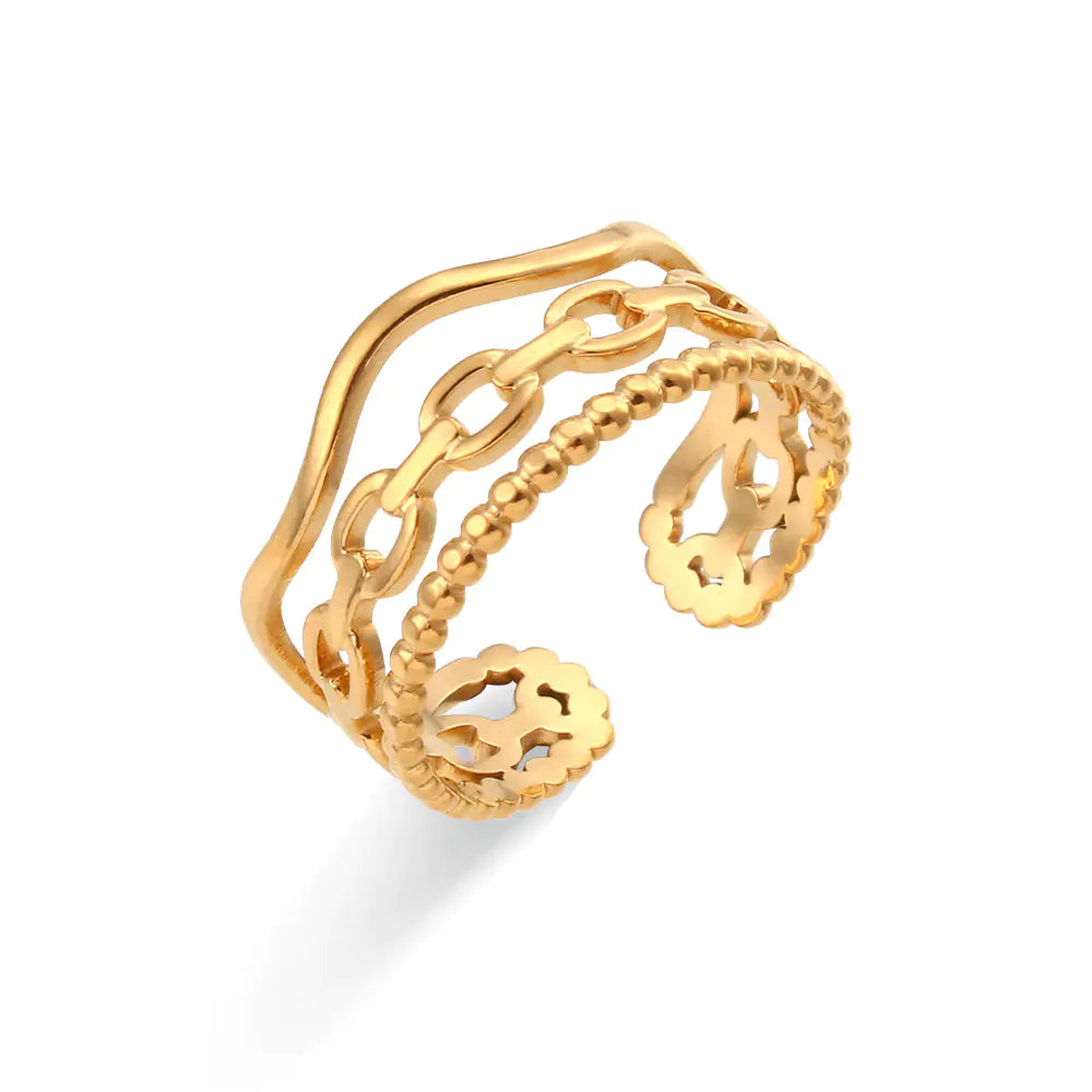 Gold open ring with intricate design on a white background