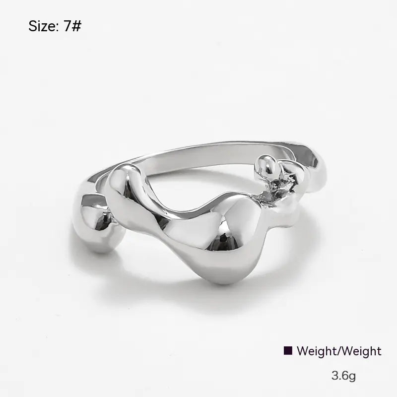 Silver ring with a unique design on a white background