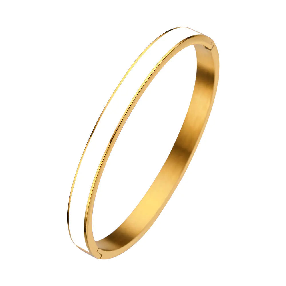 Gold bangle on a white background
