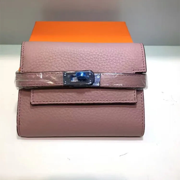 Purple wallet with a clear plastic cover on a white surface
