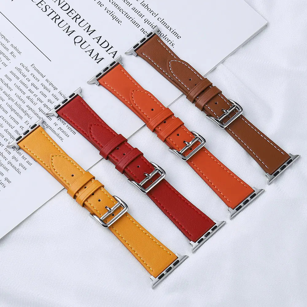 Set of four leather watch straps in different colors on a white surface with text.