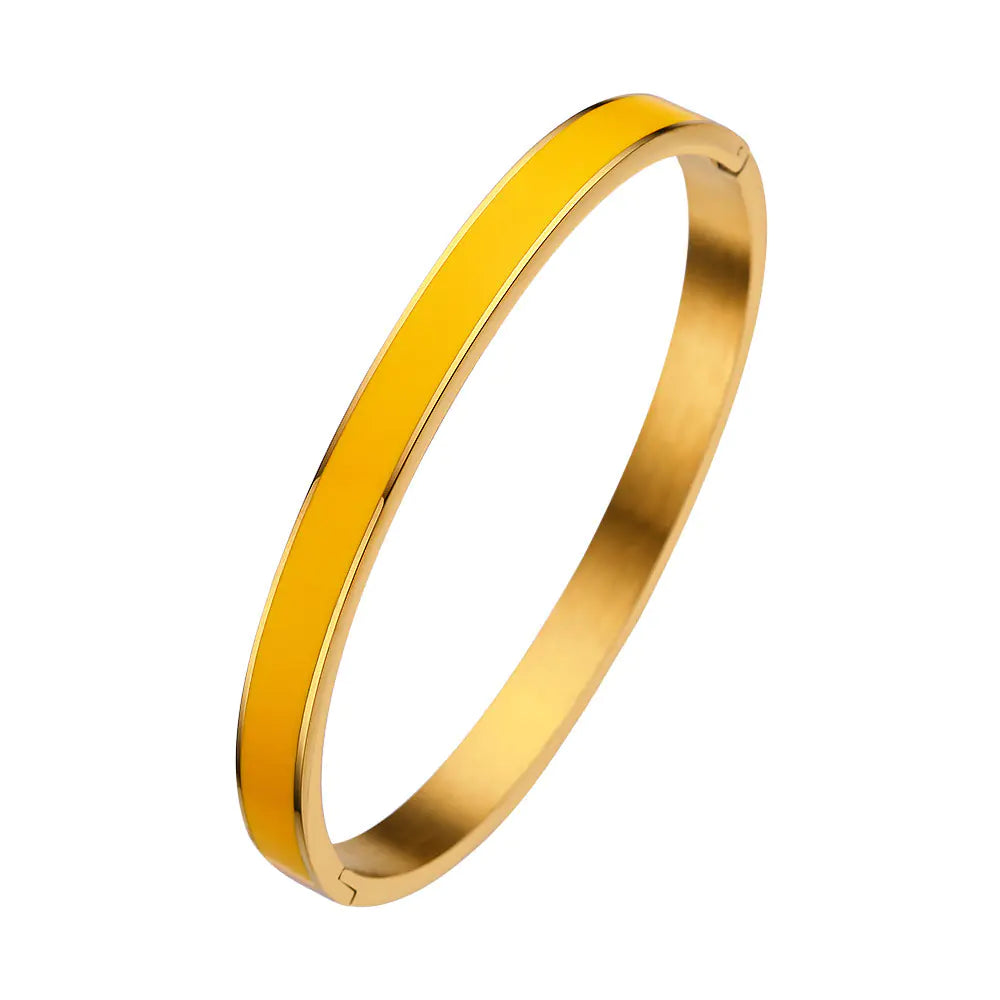 Gold bangle on a white background
