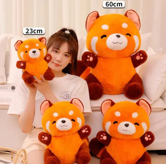 Person holding a small plush toy with a large plush toy in the background, showing different sizes.