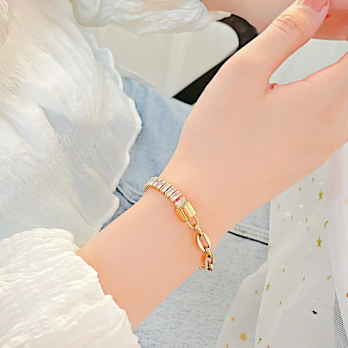 Gold bracelet on a wrist with a soft background