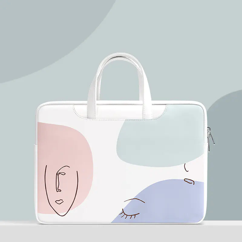 White laptop bag with abstract face design on a light gray background