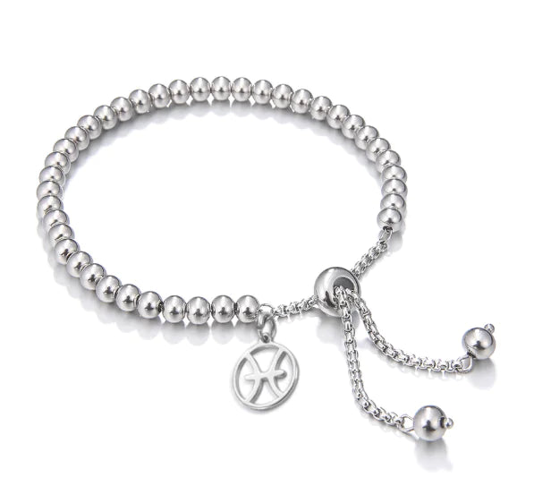Silver beaded bracelet with a charm on a white background