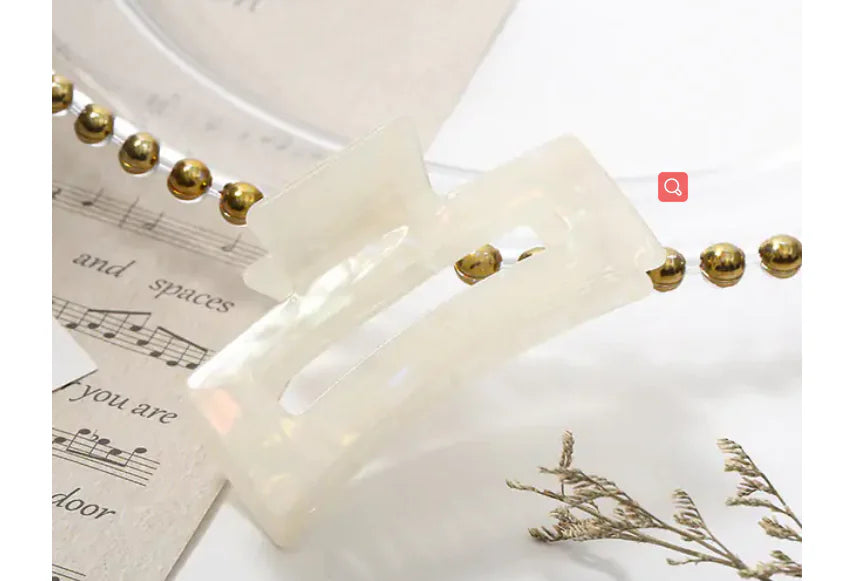 Decorative lamp with gold accents on a white background