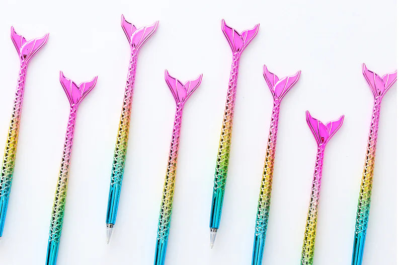 Set of colorful mermaid tail pens on a white background