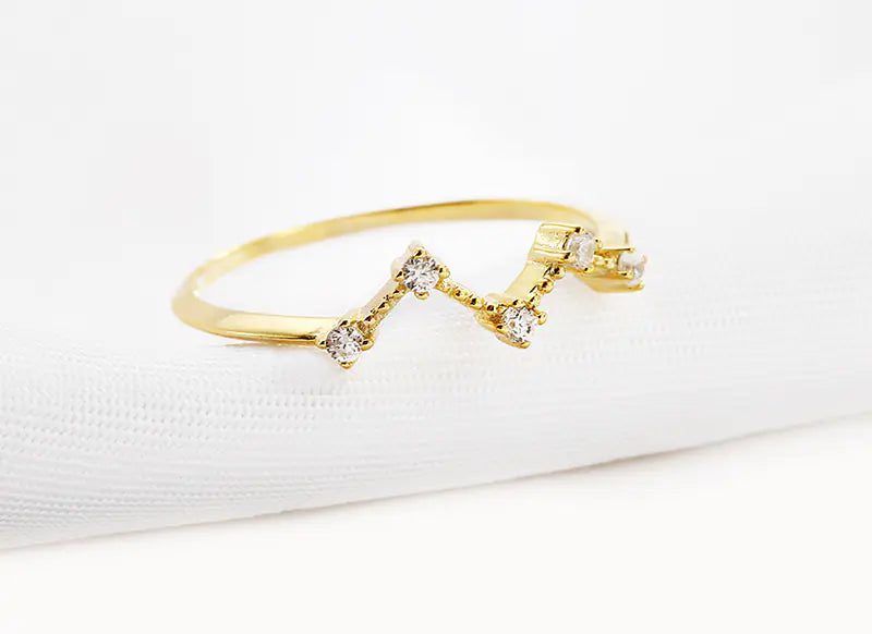 Gold bracelet with diamonds on a white background