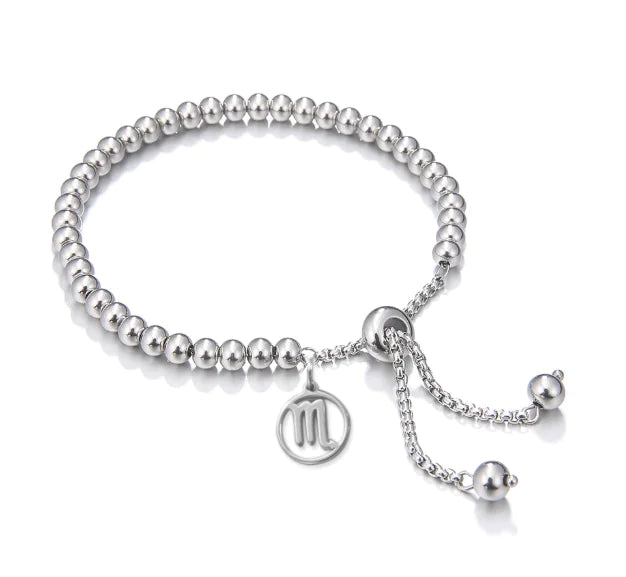 Silver bracelet with a chain and round beads on a white background