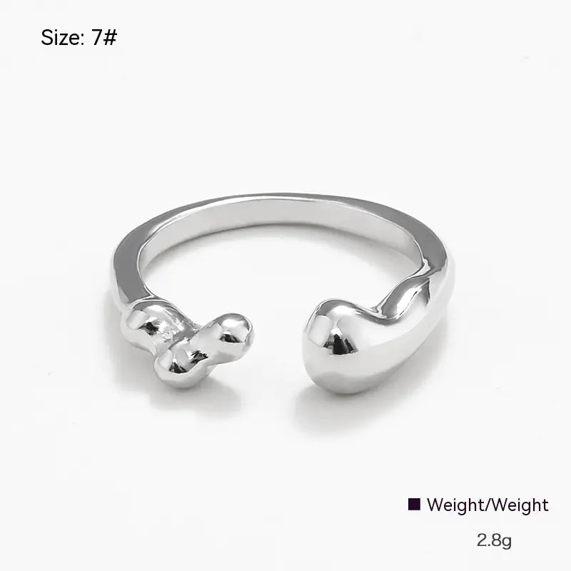 Silver ring with a unique design on a white background