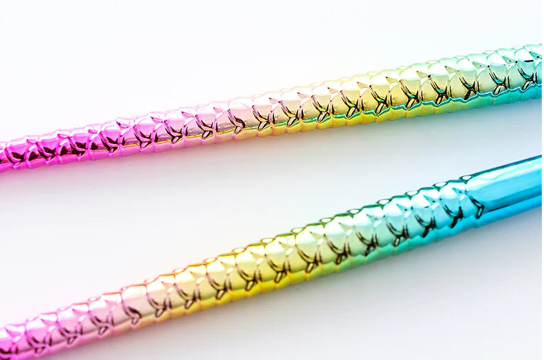 Three colorful straws with gradient patterns on a white background