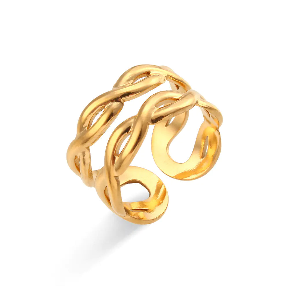 Gold twisted ring on a white background