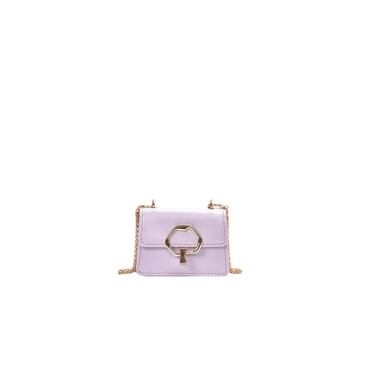 Lavender handbag with gold chain strap on a white background