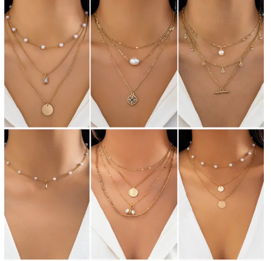 Collage of gold necklaces with various pendants on mannequins.
