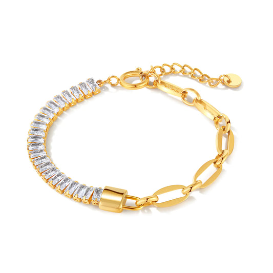 Gold bracelet with clear gemstones on a white background