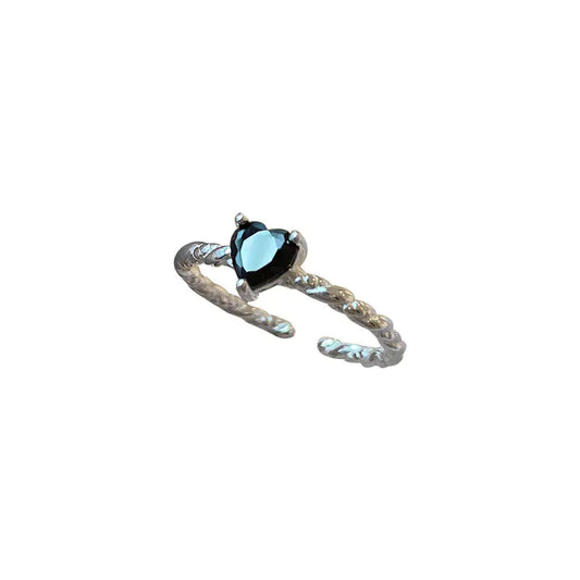Sterling-silver twist ring with black zirconia centre stone on white bacgorund.