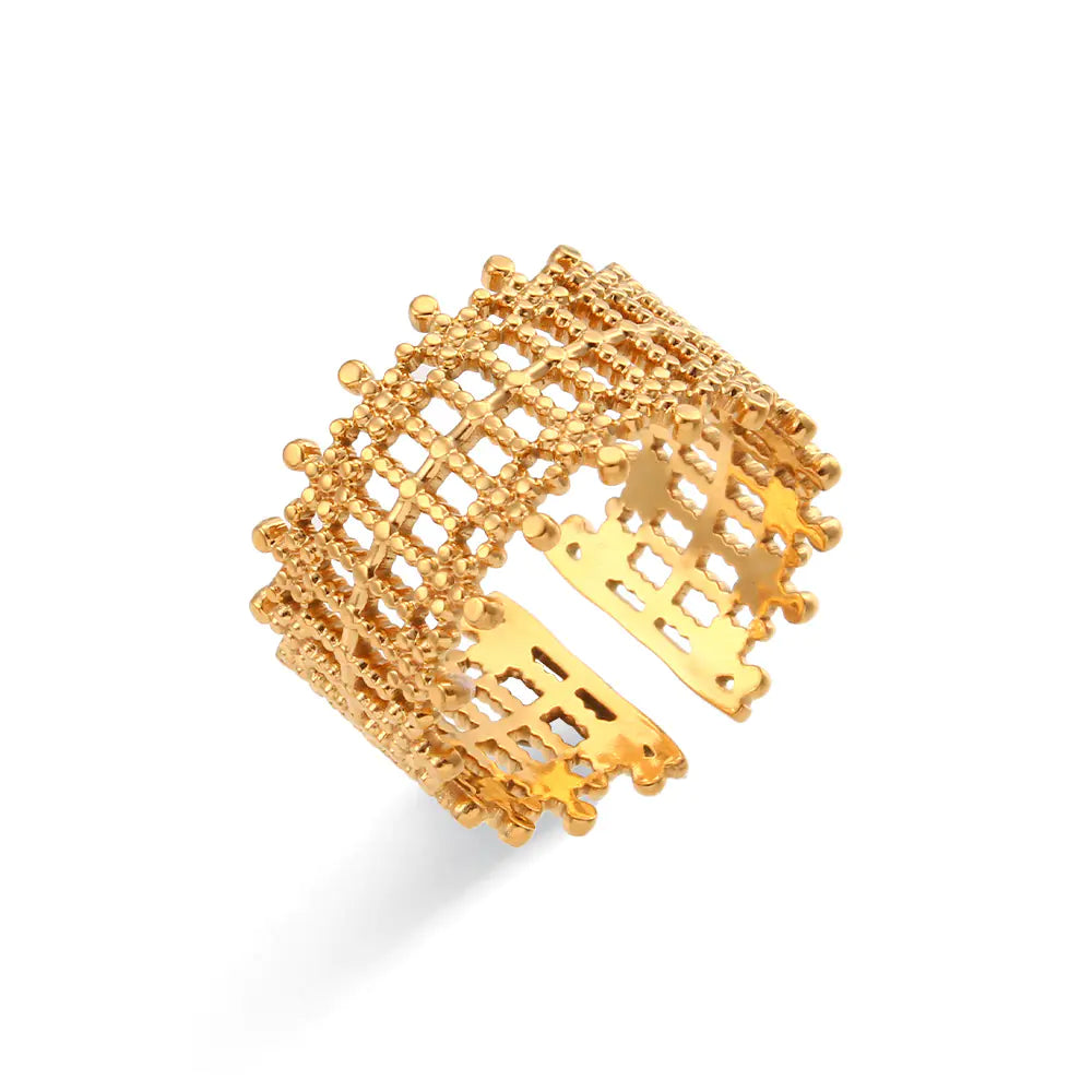 Gold cuff bracelet on a white background