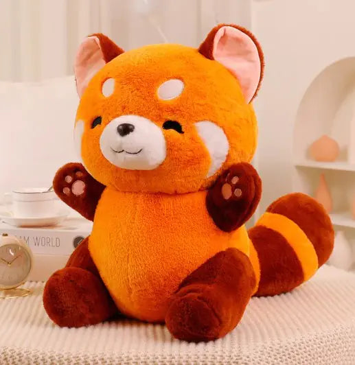 Plush toy red panda on a light background