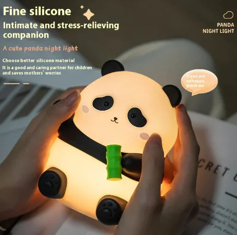 Panda night light held by a hand with text describing its features.