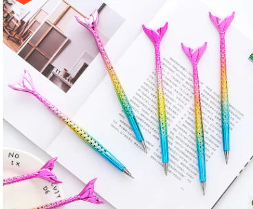 Colorful pen with gradient design on a book